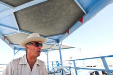Larry Harvey in his camp in his platform looking at everything.